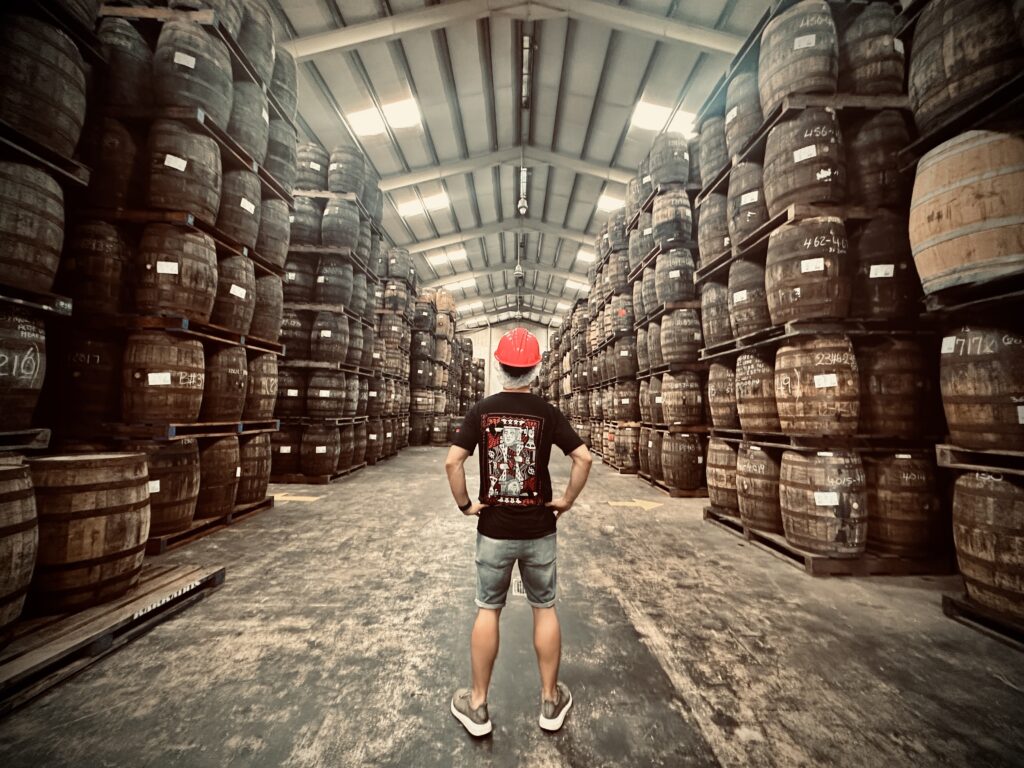 A Man in a maturation warehouse at Mount Rum Distillery