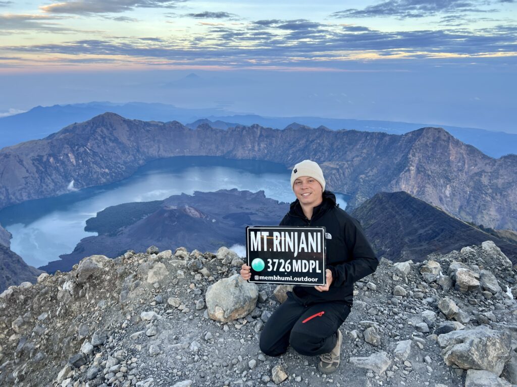 The Summit of Mount Rinjani - with the crater lake Segara Anak  in the background from summit.