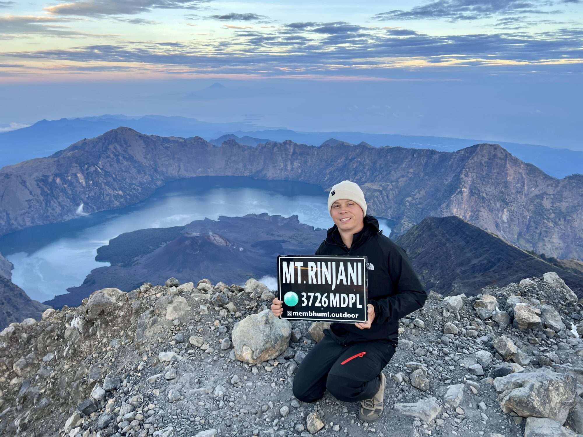 The Summit of Mount Rinjani - with the crater lake Segara Anak in the background from summit.
