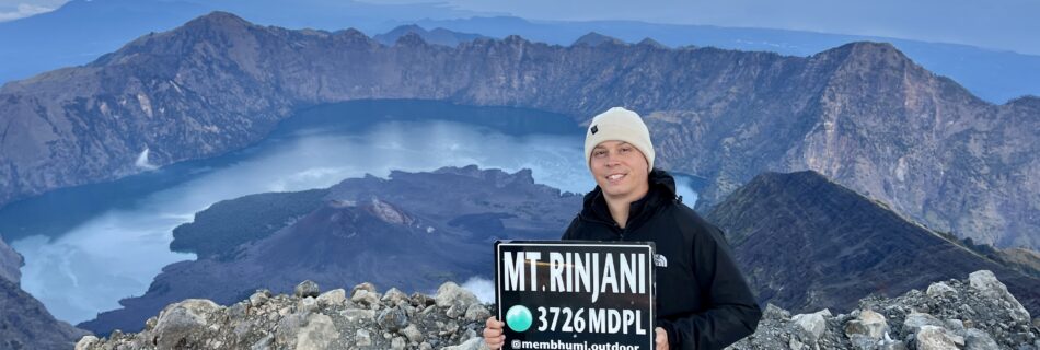 The Summit of Mount Rinjani - with the crater lake Segara Anak in the background from summit.