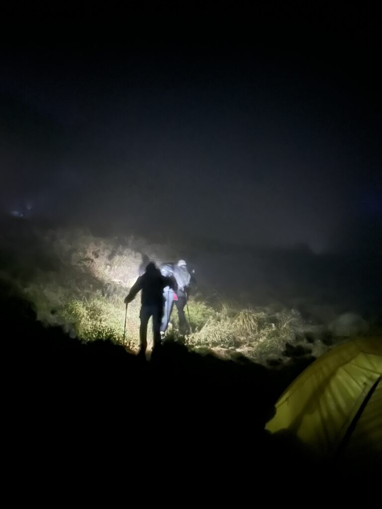 Hiking Mount Rinjani, Lombok. hikers setting out from the camp site on the crater ridge for a 2am summit hike.