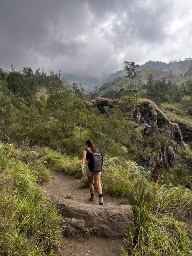 Hiking Mount Rinjani, Lombok. Hikers along the upper path between POS2 and POS3.
